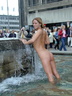 nude in city fountain 1