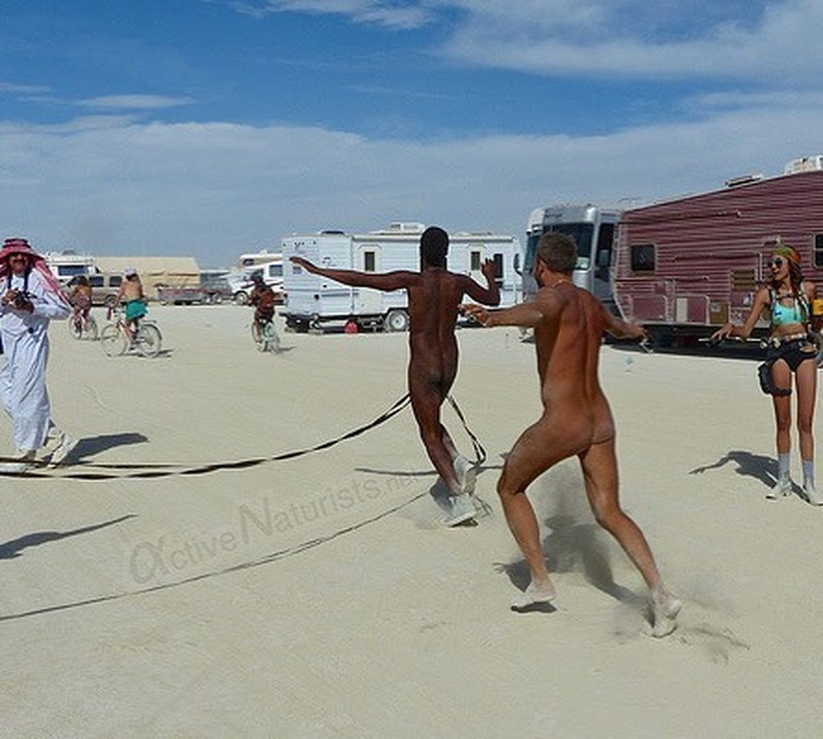 https://www.nudismlife.com/galleries/public_nudity/burning_man/active_naturists/active_naturists_003.jpg